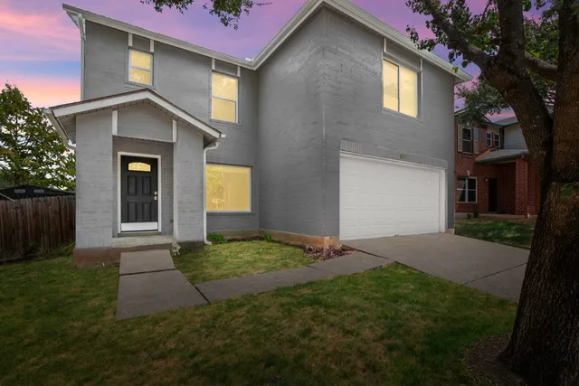 a house with garden in front of it