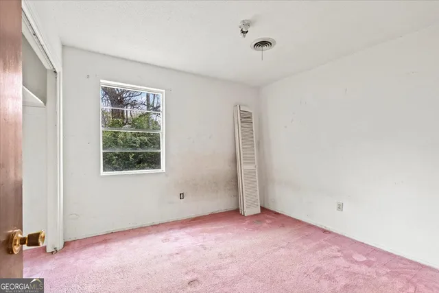 an empty room with windows