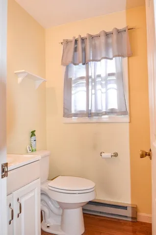 a white toilet sitting next to a bathroom sink