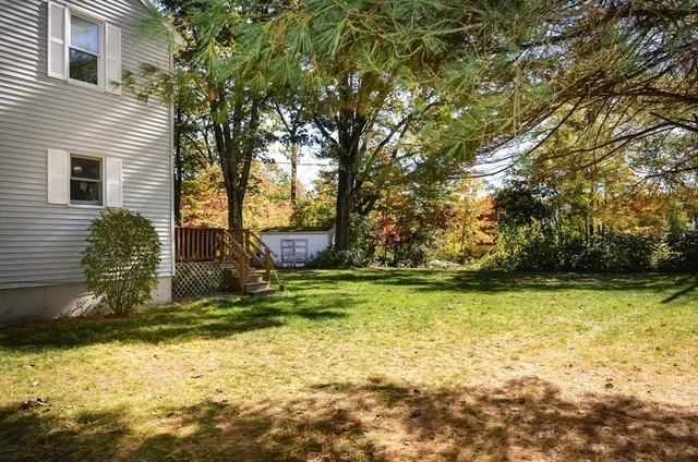 a view of swimming pool with a yard