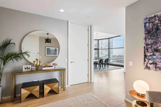 a living room with furniture and flowers