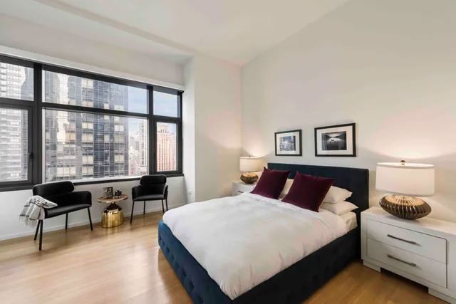 a large white kitchen with a large window