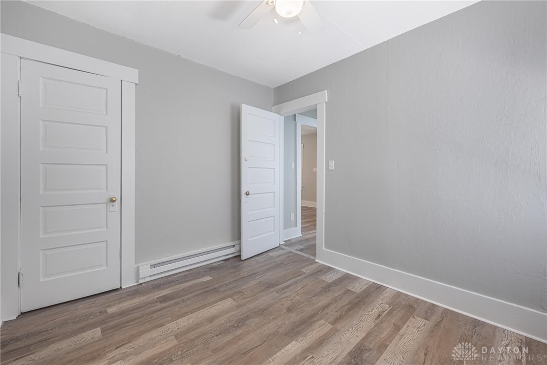 2118 Hillside Avenue Springfield, OH 45503 - Photo 15 of 28 This spacious room features elegant flooring and abundant natural light, offering a versatile living space.