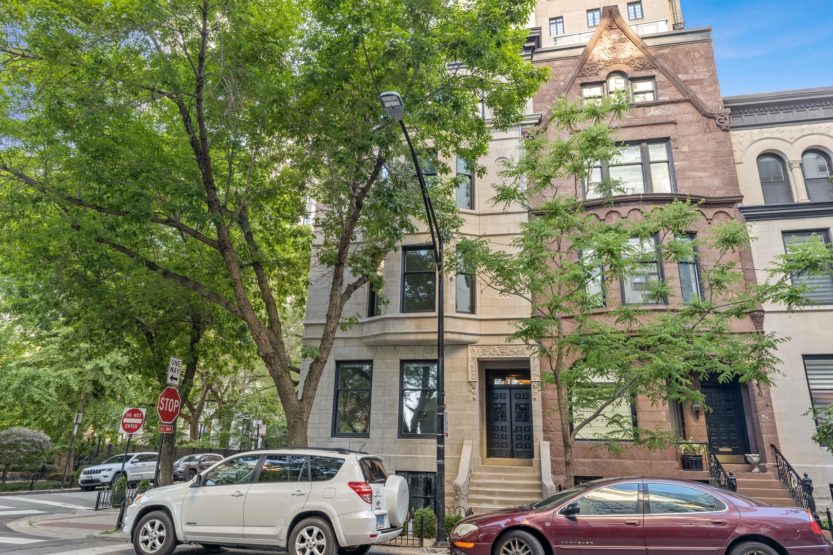 1300 North Ritchie Court, Unit 1 Chicago, IL 60610 - Photo 1 of 10 a car parked in front of a building