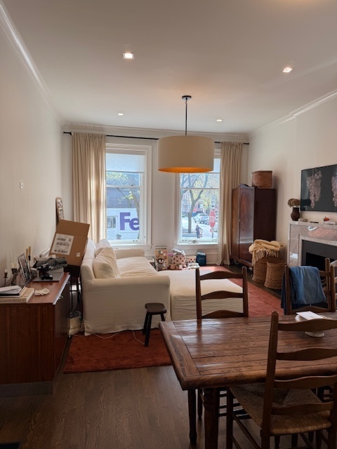 1300 North Ritchie Court, Unit 1 Chicago, IL 60610 - Photo 2 of 10 a living room with furniture and a window