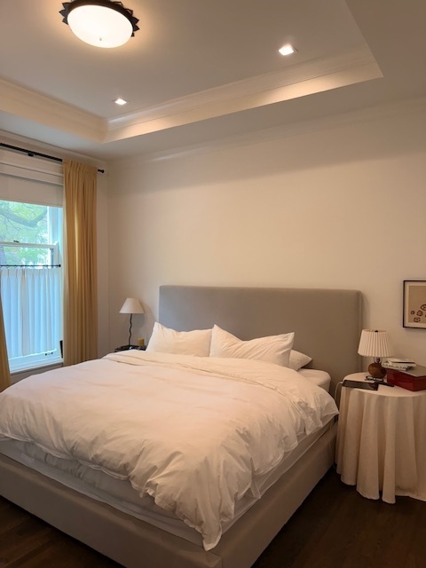 1300 North Ritchie Court, Unit 1 Chicago, IL 60610 - Photo 7 of 10 a large bed sitting in a bedroom next to a window