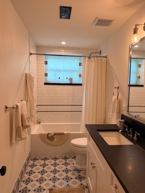 1300 North Ritchie Court, Unit 1 Chicago, IL 60610 - Photo 8 of 10 a bathroom with a sink a toilet and shower