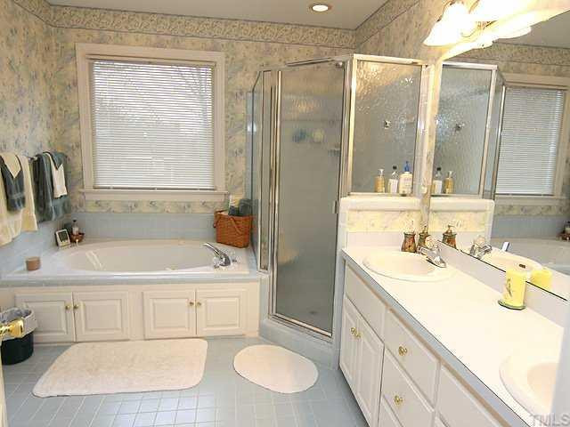 7909 Laurel Mountain Road Raleigh, NC 27613 - Photo 8 of 12 Spacious master bath has walk-in closet and water closet! Master Bath/Spa