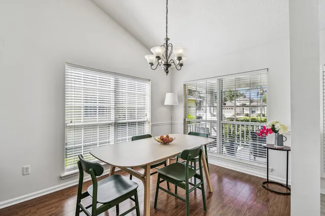 a view of a dining room with furniture window and wooden floor