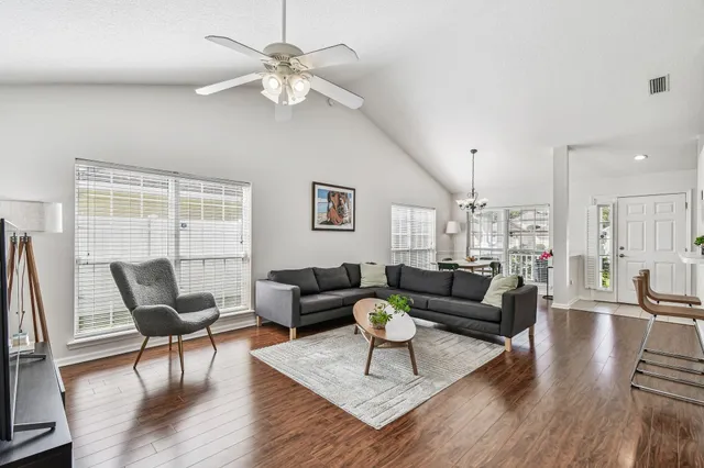 a living room with furniture and a large window