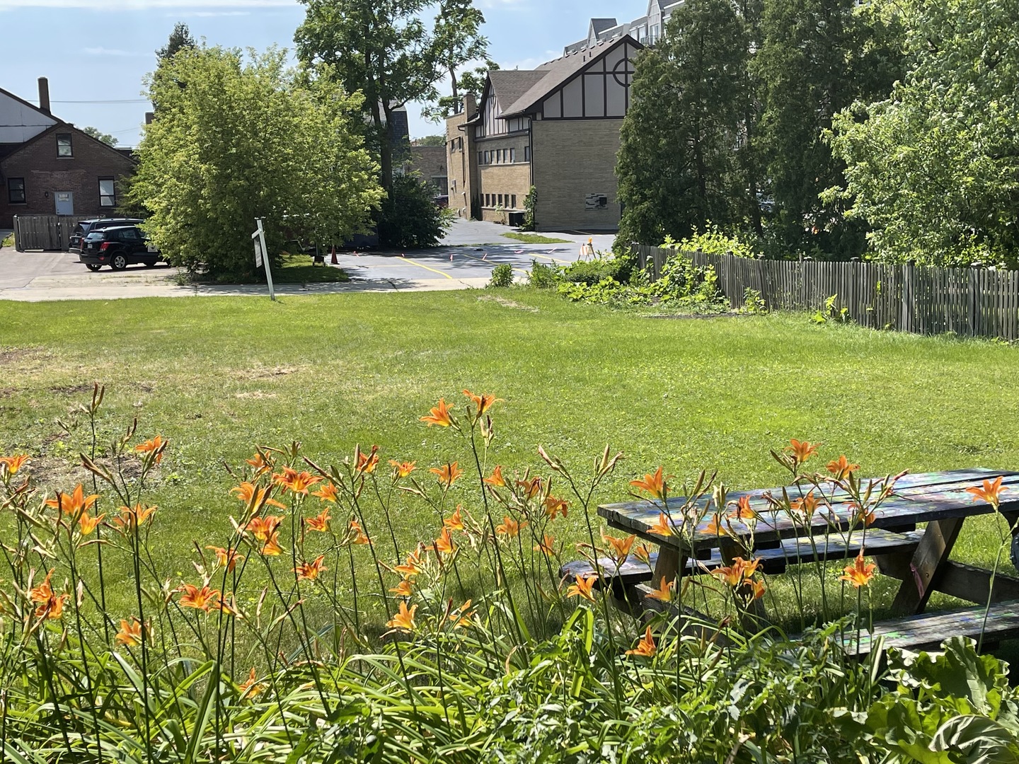 308 South Washington Street Wheaton, IL 60187 - Photo 2 of 27 a view of a swimming pool with lawn chairs and plants