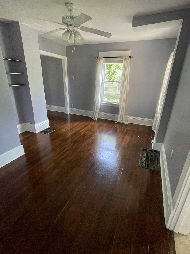 308 South Washington Street Wheaton, IL 60187 - Photo 11 of 27 wooden floor in an empty room with a window