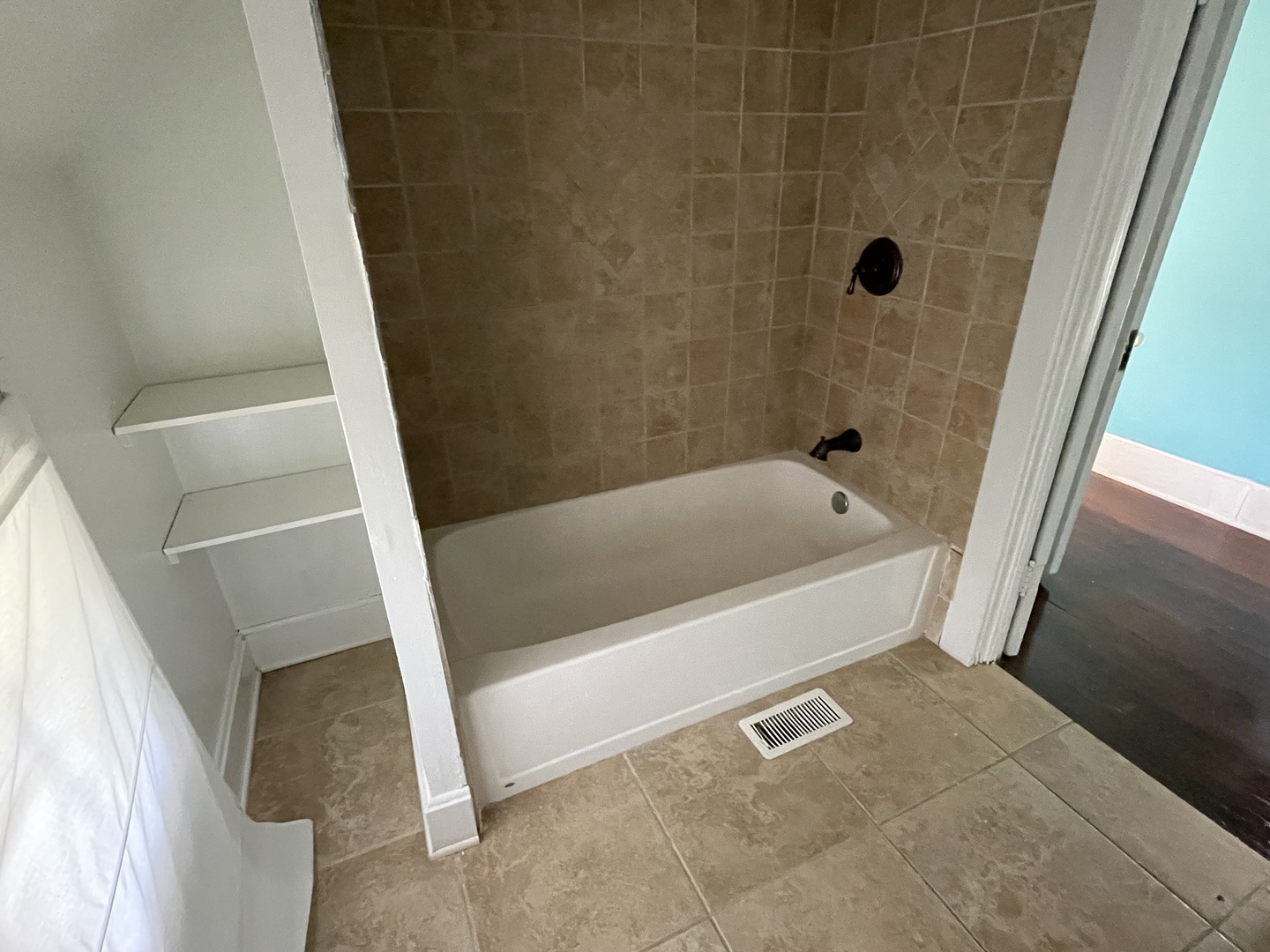 308 South Washington Street Wheaton, IL 60187 - Photo 19 of 27 a white bath tub sitting in a bathroom