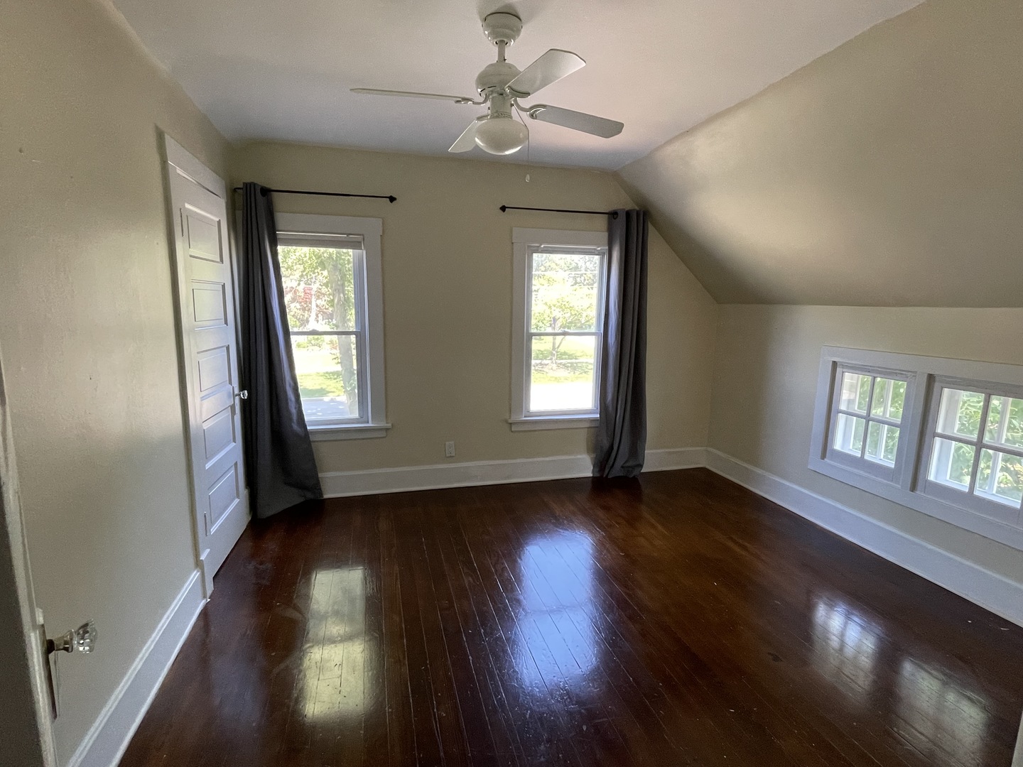 308 South Washington Street Wheaton, IL 60187 - Photo 21 of 27 a view of an empty room with wooden floor and a window