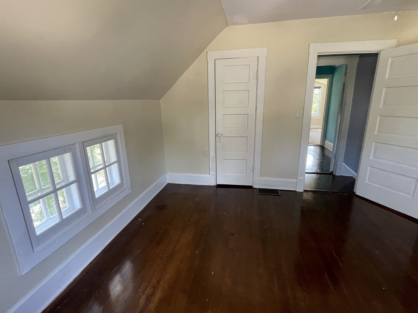 308 South Washington Street Wheaton, IL 60187 - Photo 22 of 27 an empty room with wooden floor and windows