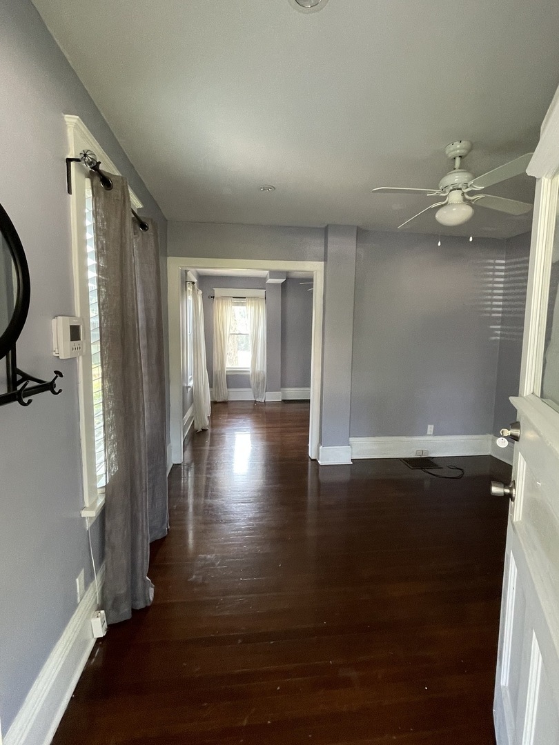 308 South Washington Street Wheaton, IL 60187 - Photo 7 of 27 wooden floor in an empty room with a window