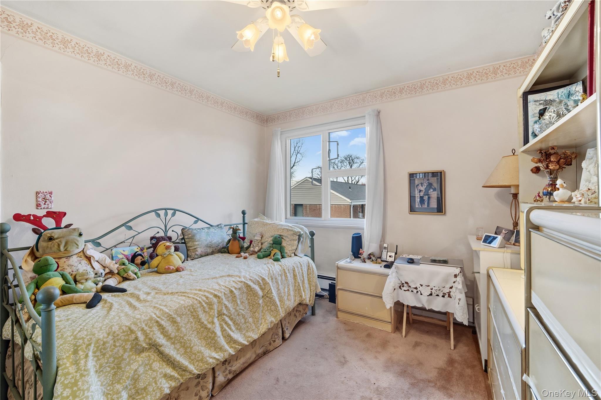 220-47 73rd Avenue, Unit UPPR Queens, NY 11364 - Photo 12 of 19 Bedroom featuring carpet flooring, a ceiling fan, a baseboard radiator, and crown molding