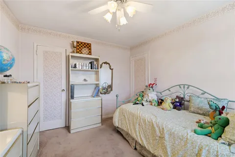 a bedroom with a bed and a cabinets