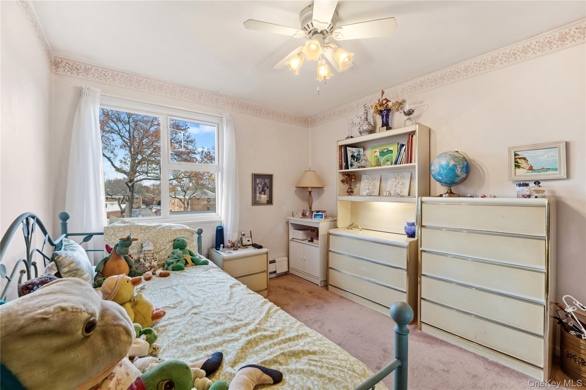 220-47 73rd Avenue, Unit UPPR Queens, NY 11364 - Photo 14 of 19 Bedroom featuring light colored carpet, ceiling fan, ornamental molding, and baseboard heating