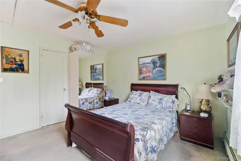 a bed room with a bed and a chandelier