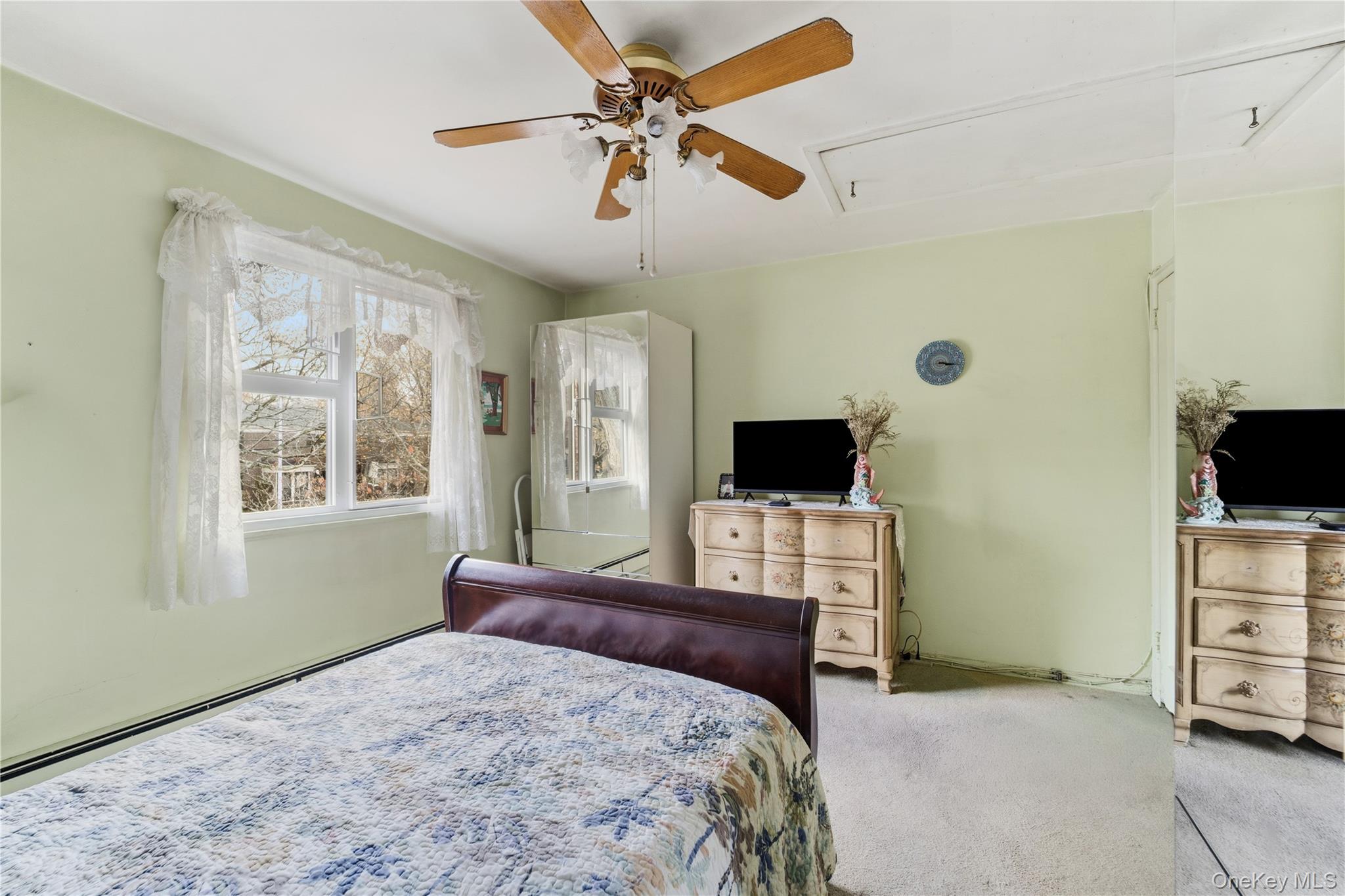 220-47 73rd Avenue, Unit UPPR Queens, NY 11364 - Photo 17 of 19 Bedroom featuring carpet, attic access, and ceiling fan