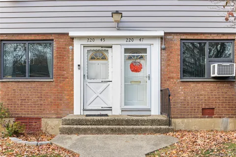 a front view of a house with a garage