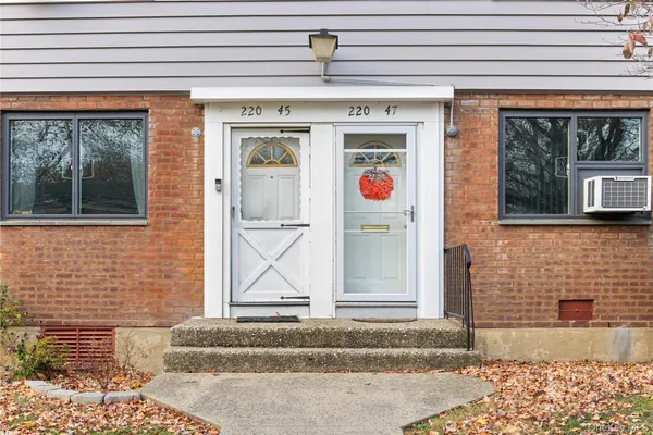 a front view of a house with a garage