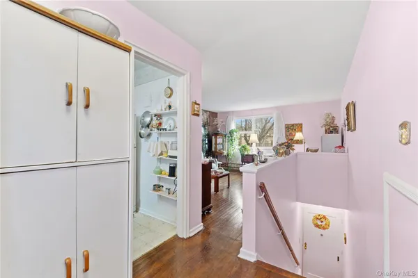 a view of an entryway with wooden floor