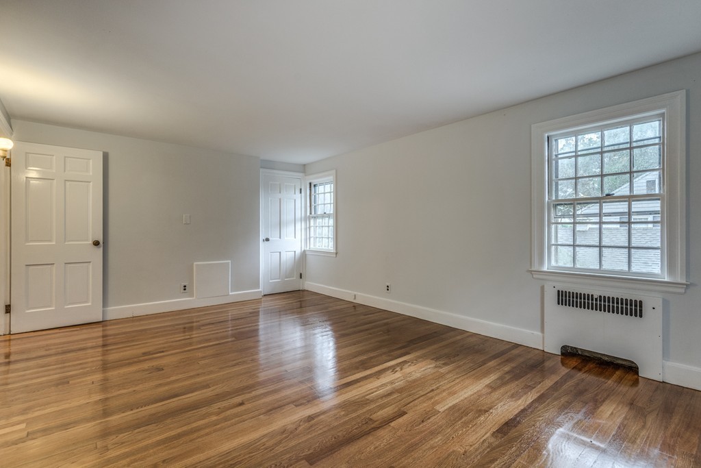 24 Gordon Road Milton, MA 02186 - Photo 21 of 30 wooden floor in an empty room with a window