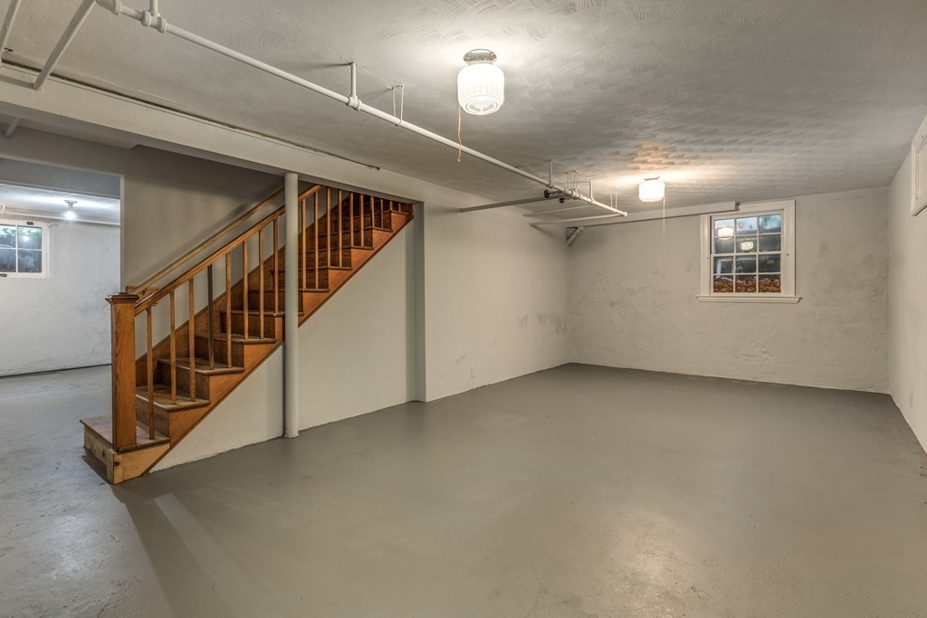 24 Gordon Road Milton, MA 02186 - Photo 24 of 30 a view of an empty room with stairs