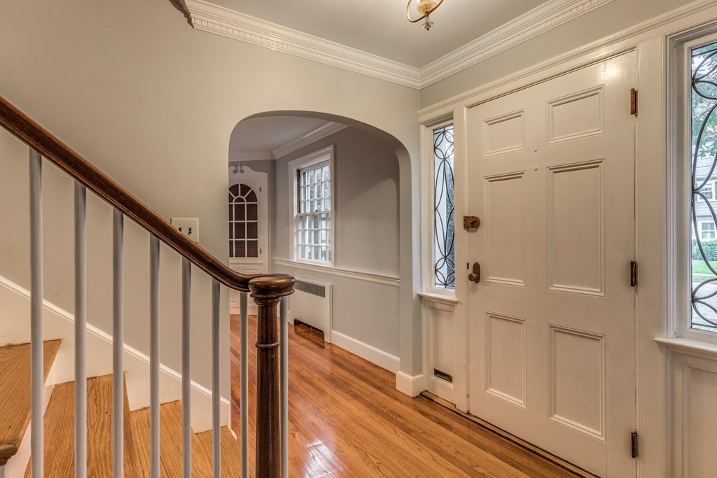 24 Gordon Road Milton, MA 02186 - Photo 4 of 30 a view of a hallway with wooden floor and entryway