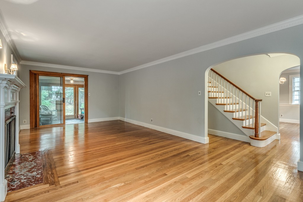 24 Gordon Road Milton, MA 02186 - Photo 5 of 30 a view of an empty room with wooden floor and a window