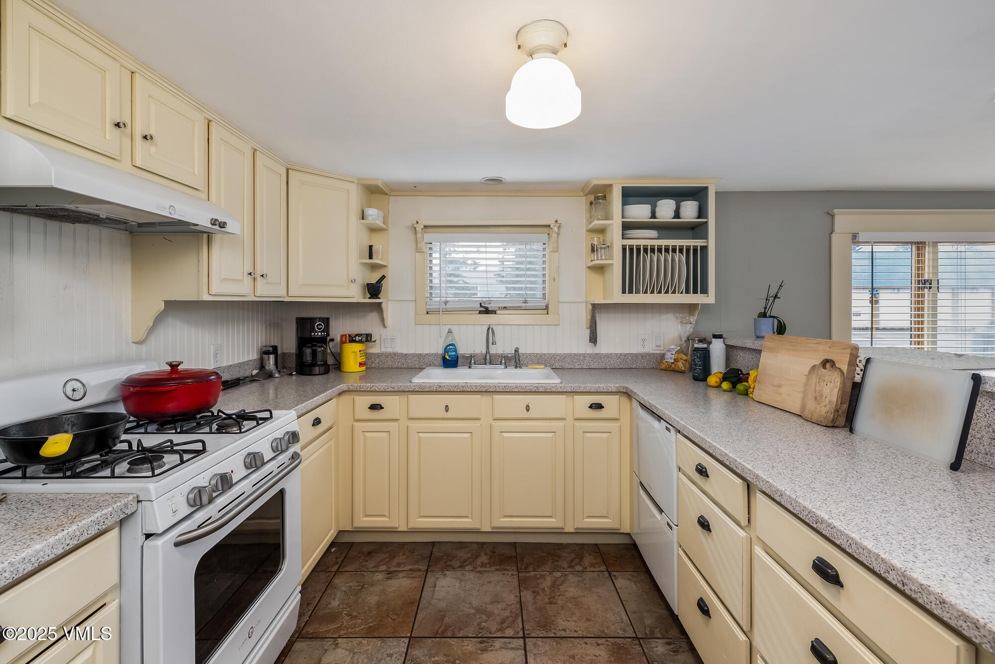 246 Capitol Street Eagle, CO 81631 - Photo 12 of 31 a kitchen with cabinets appliances a sink and a window