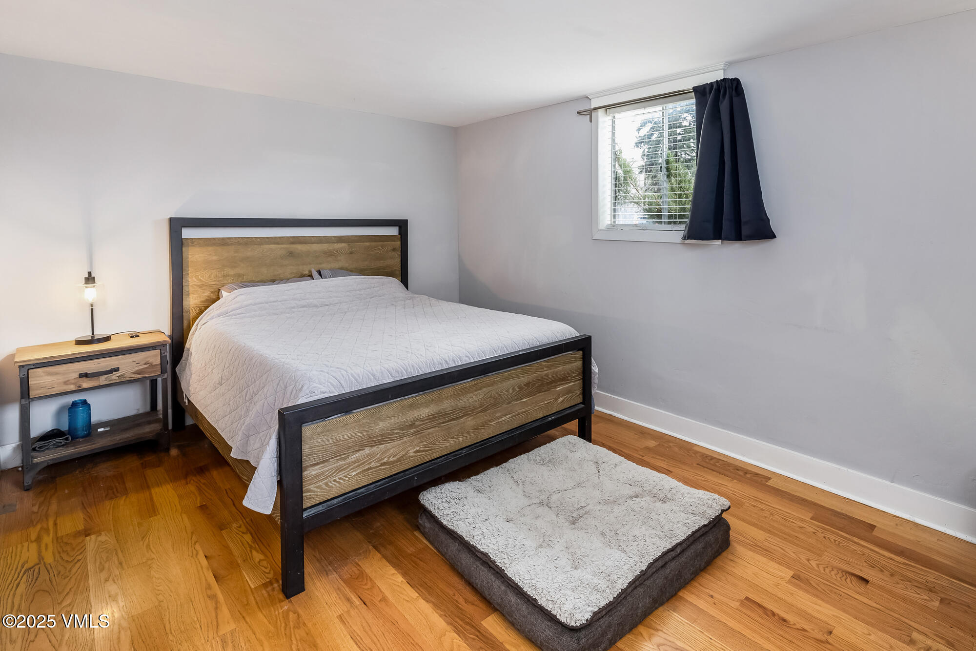 246 Capitol Street Eagle, CO 81631 - Photo 22 of 31 a bed sitting in a bedroom next to a window