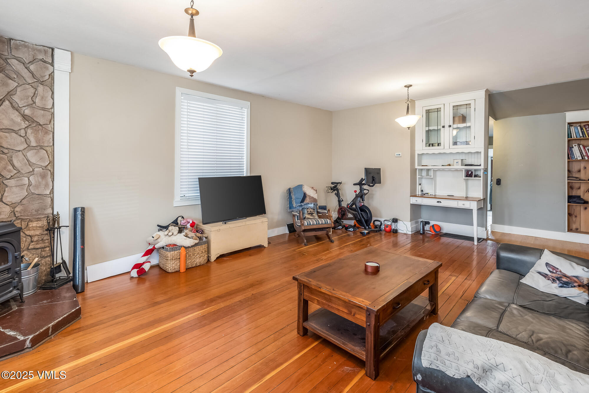 246 Capitol Street Eagle, CO 81631 - Photo 8 of 31 a living room with furniture a flat screen tv and a table