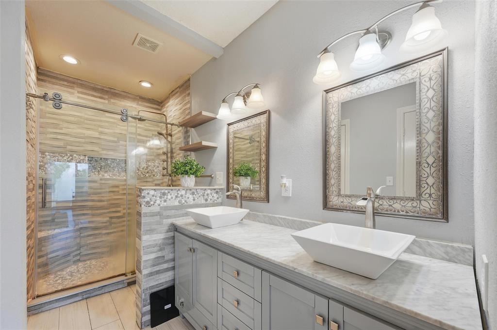 1904 Signal Ridge Place Rockwall, TX 75032 - Photo 19 of 23 Full bath with double vanity, a shower stall, and recessed lighting