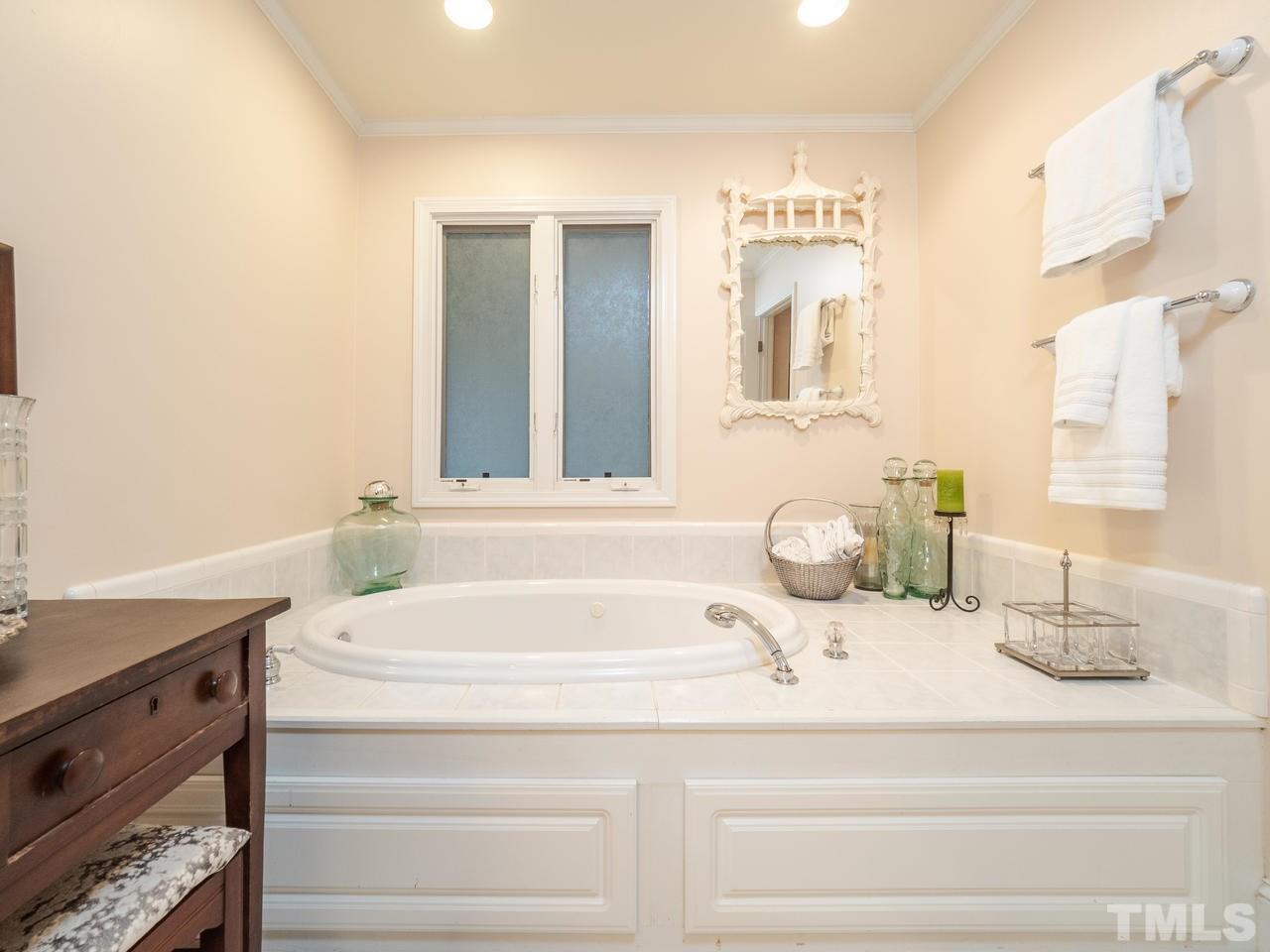 1707 Nottingham Road Raleigh, NC 27607 - Photo 14 of 25 a bathroom with a sink and a mirror