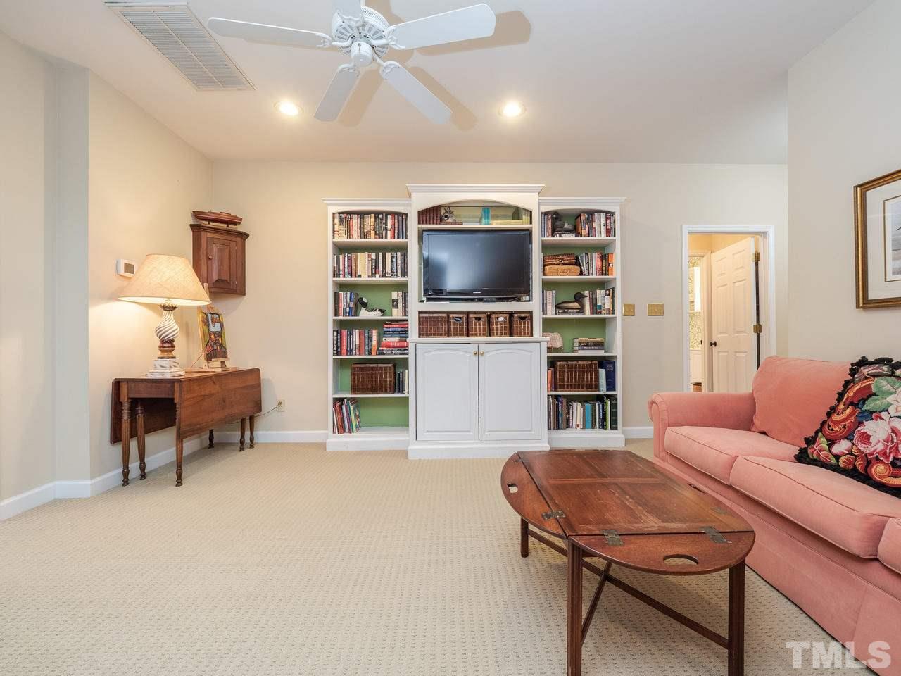 1707 Nottingham Road Raleigh, NC 27607 - Photo 22 of 25 a living room with furniture and a flat screen tv