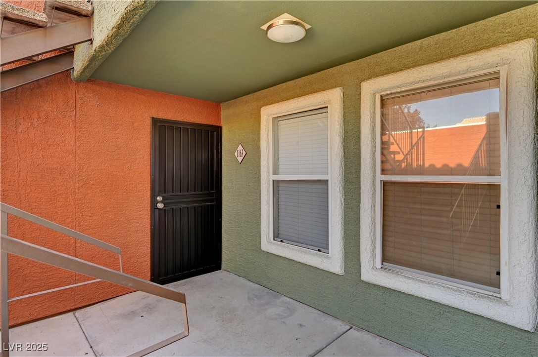 8101 West Flamingo Road, Unit 1163 Las Vegas, NV 89147 - Photo 2 of 45 Doorway to property featuring stucco siding