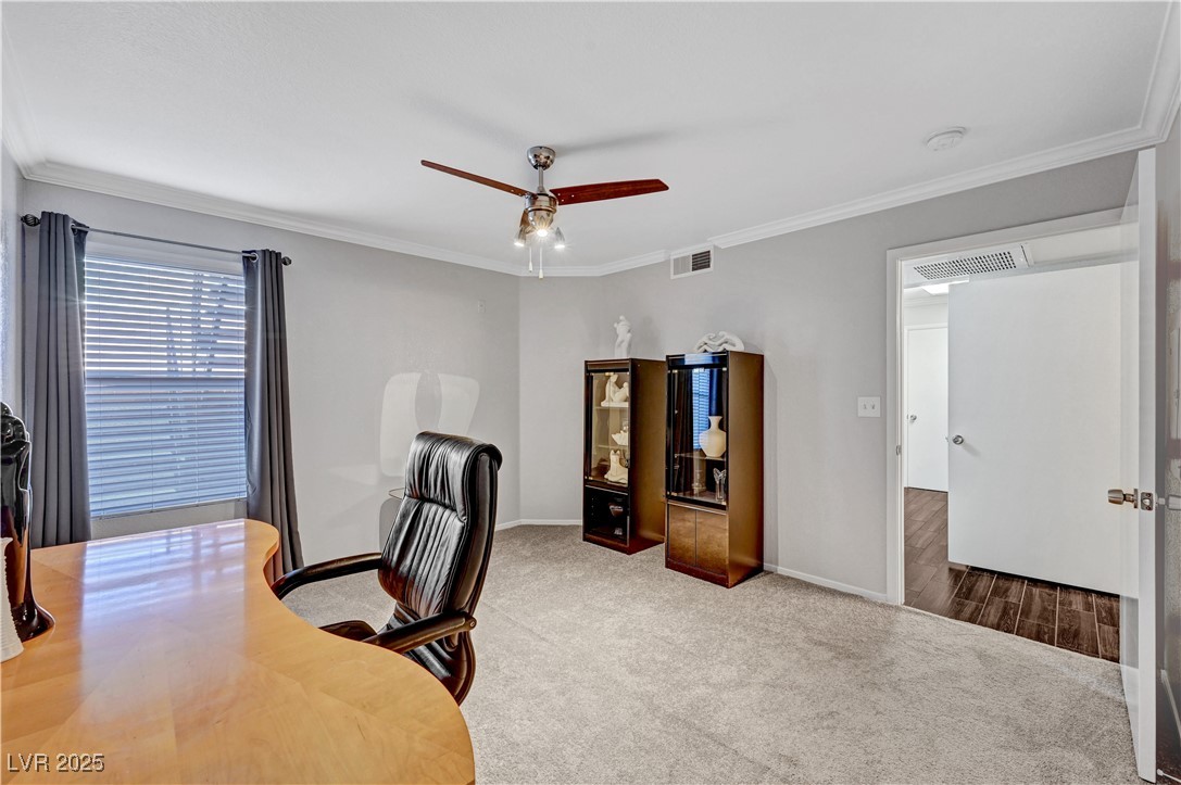 8101 West Flamingo Road, Unit 1163 Las Vegas, NV 89147 - Photo 21 of 45 Carpeted office with ornamental molding and a ceiling fan