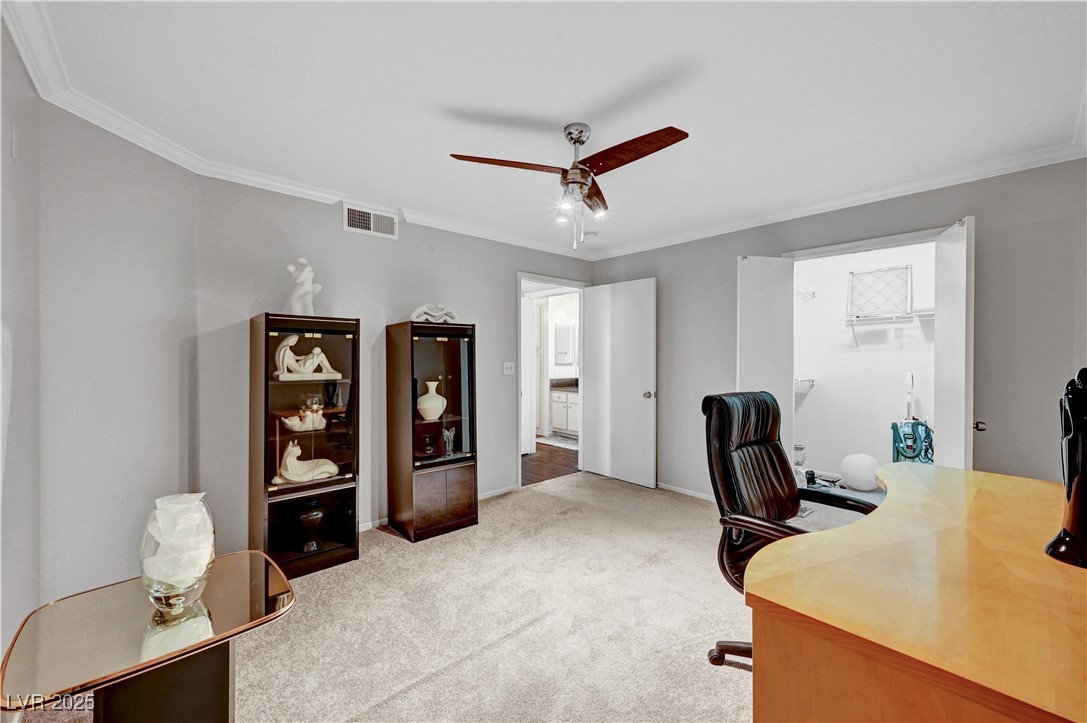 8101 West Flamingo Road, Unit 1163 Las Vegas, NV 89147 - Photo 22 of 45 Office space featuring crown molding, light carpet, and ceiling fan