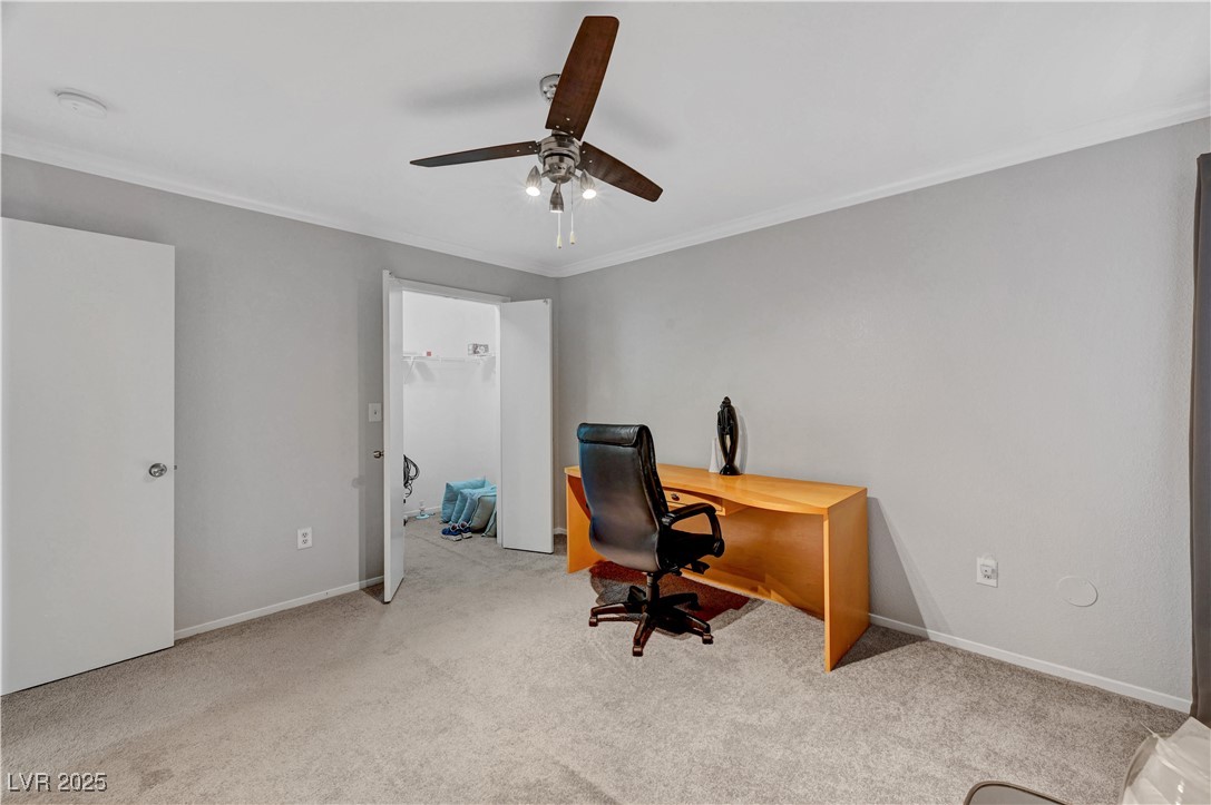 8101 West Flamingo Road, Unit 1163 Las Vegas, NV 89147 - Photo 23 of 45 Home office with ornamental molding, carpet, and a ceiling fan