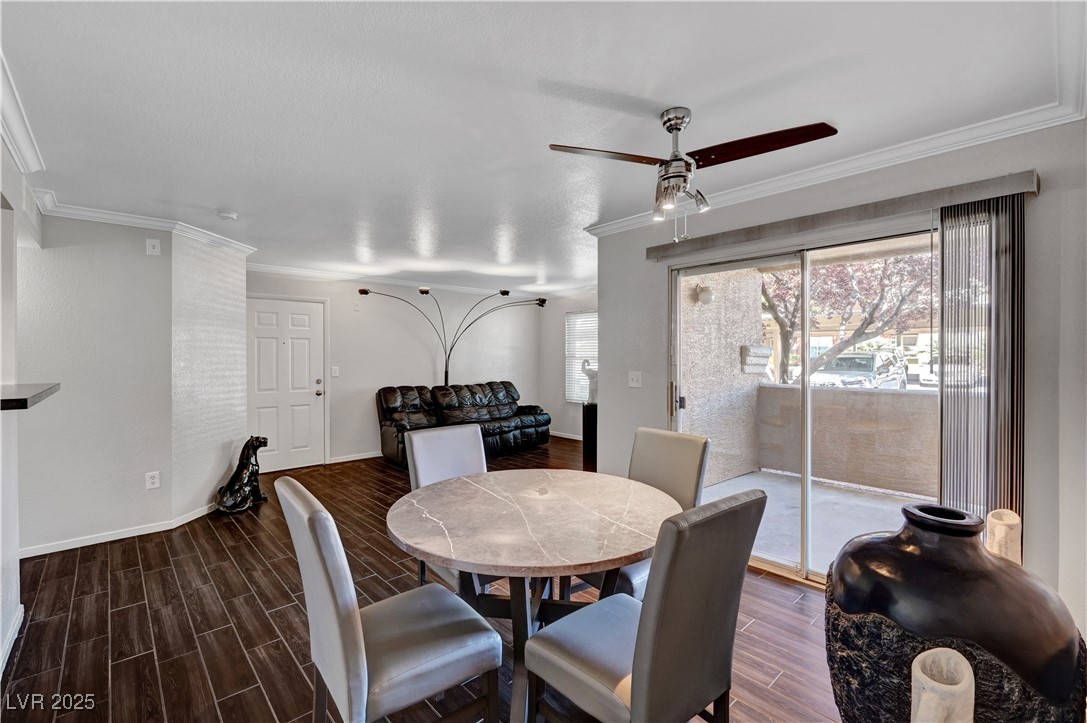 8101 West Flamingo Road, Unit 1163 Las Vegas, NV 89147 - Photo 8 of 45 Dining space with ornamental molding, wood finish floors, and ceiling fan