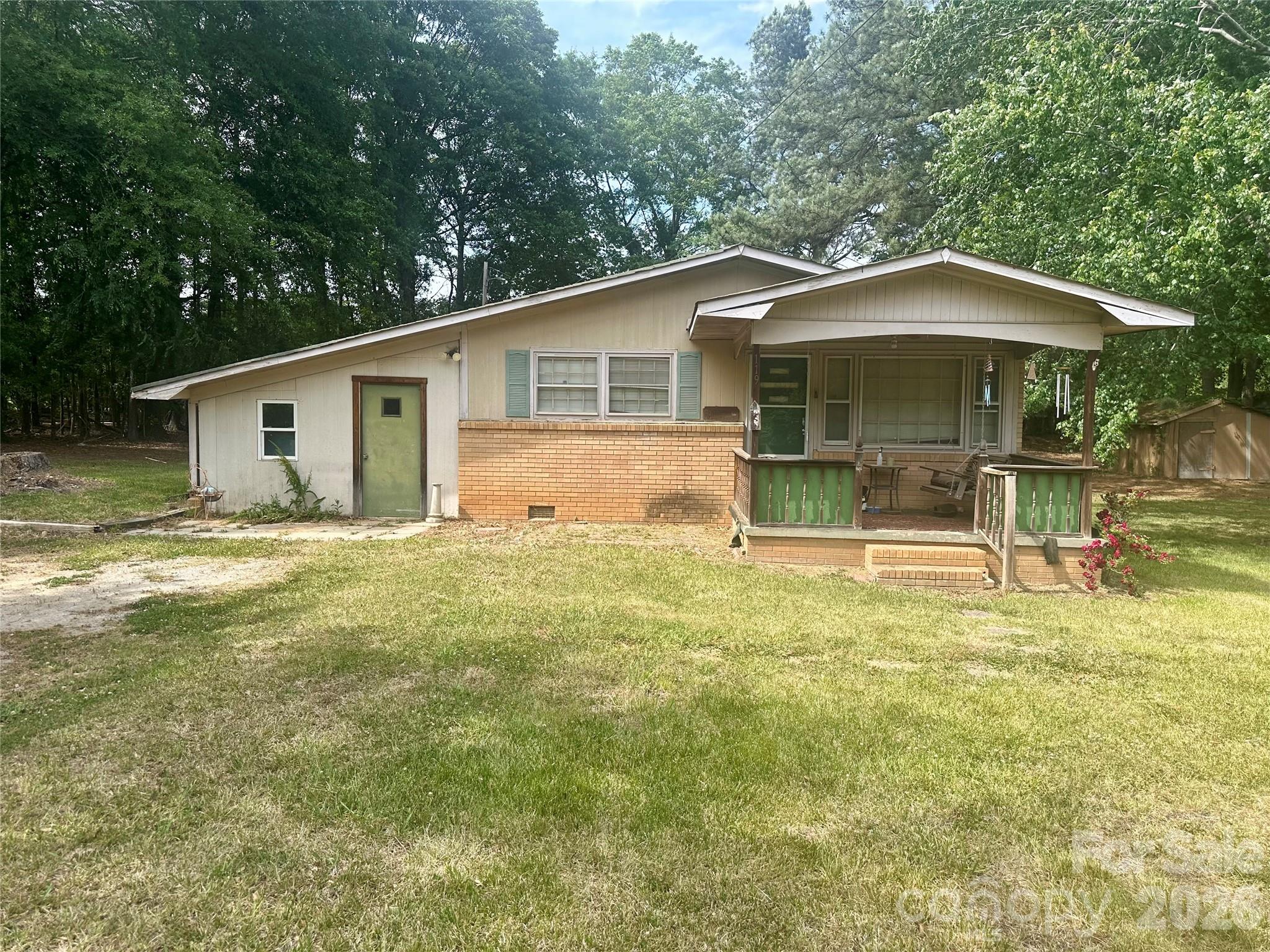 119 Stedman Road Dallas, NC 28034 - Photo 1 of 11 a front view of a house with garden