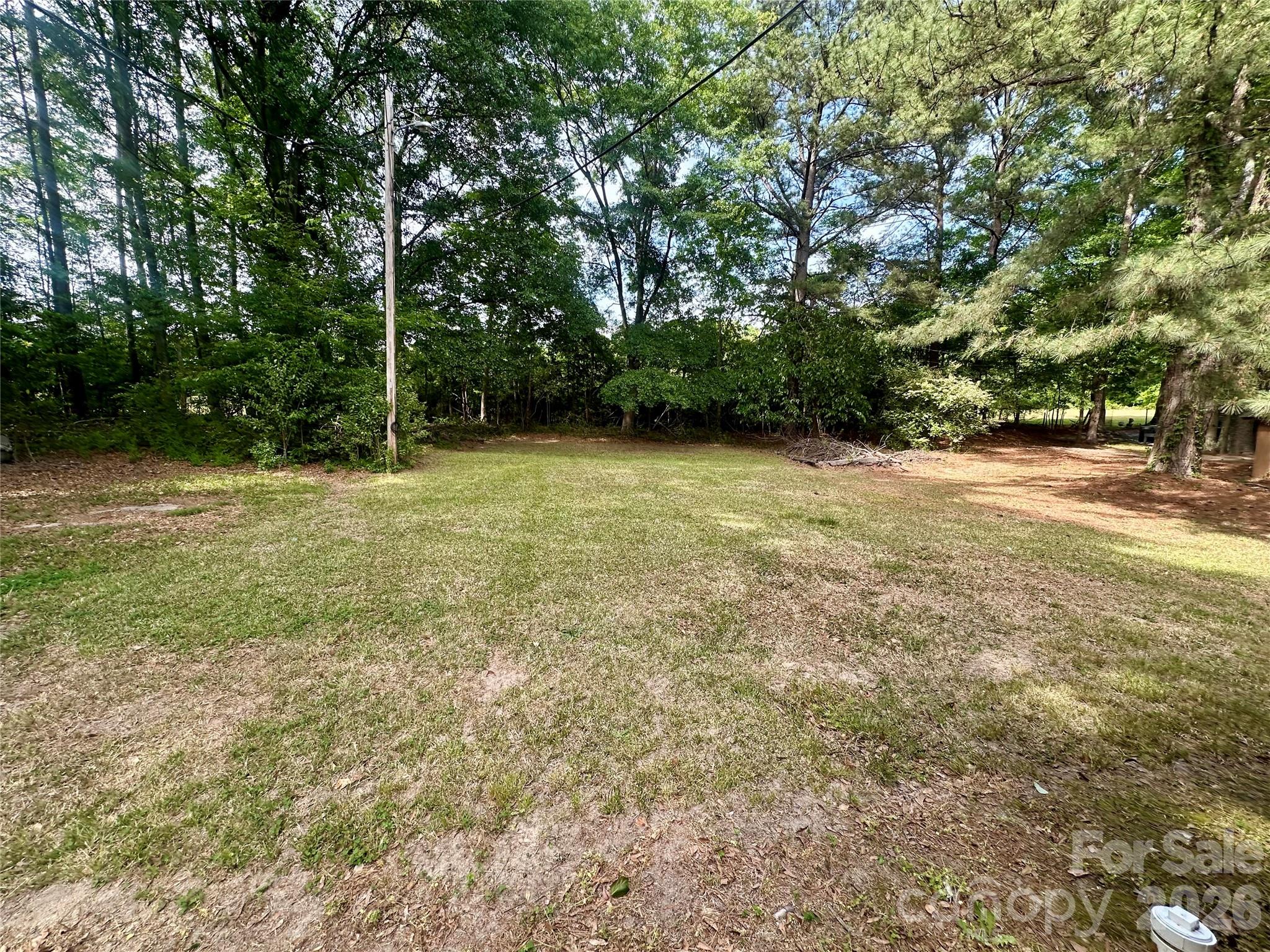 119 Stedman Road Dallas, NC 28034 - Photo 11 of 11 a backyard of a house with lots of green space