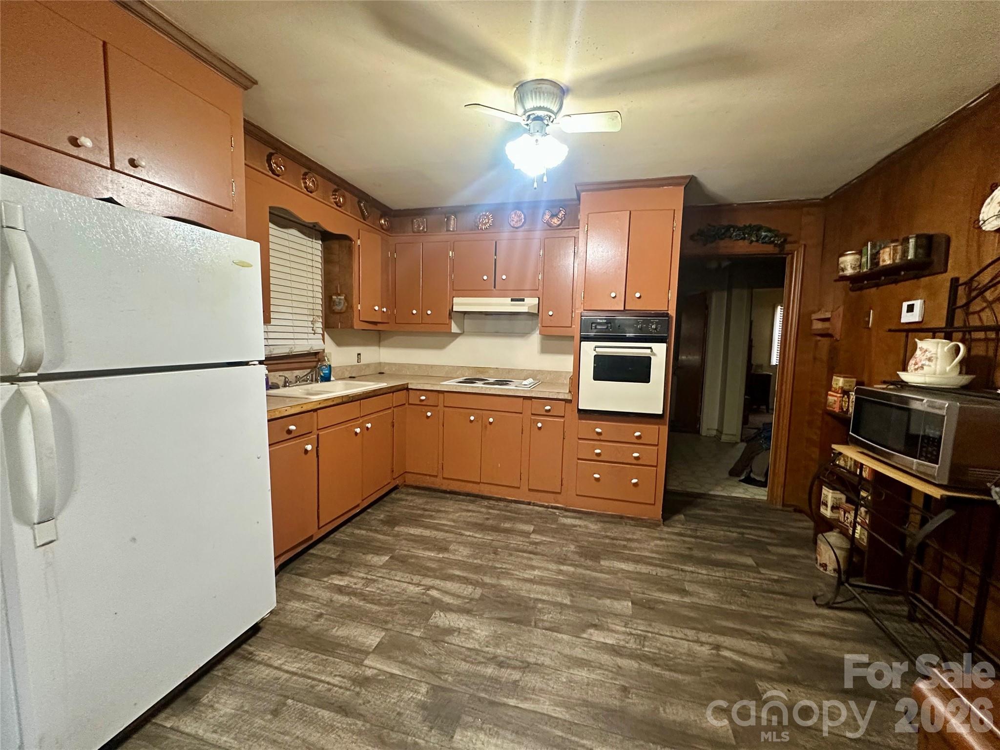 119 Stedman Road Dallas, NC 28034 - Photo 4 of 11 a kitchen with stainless steel appliances granite countertop a refrigerator a stove and a sink