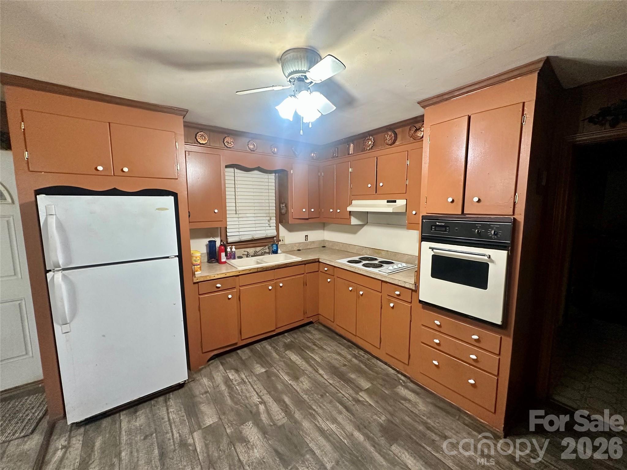 119 Stedman Road Dallas, NC 28034 - Photo 6 of 11 a kitchen with a refrigerator a stove top oven a sink and cabinets