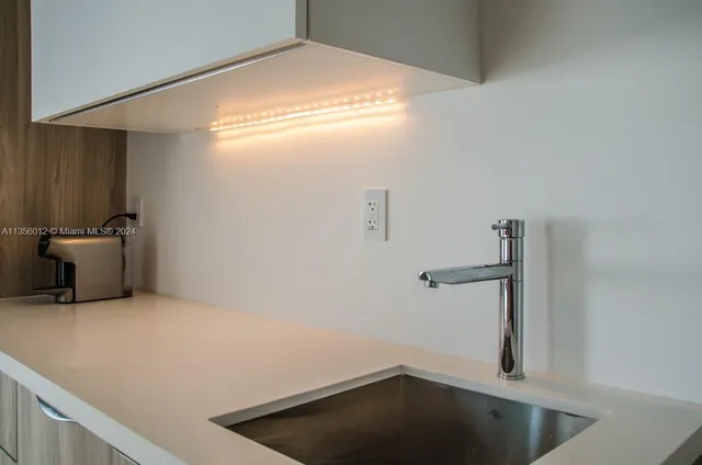 a view of storage and utility room with closet