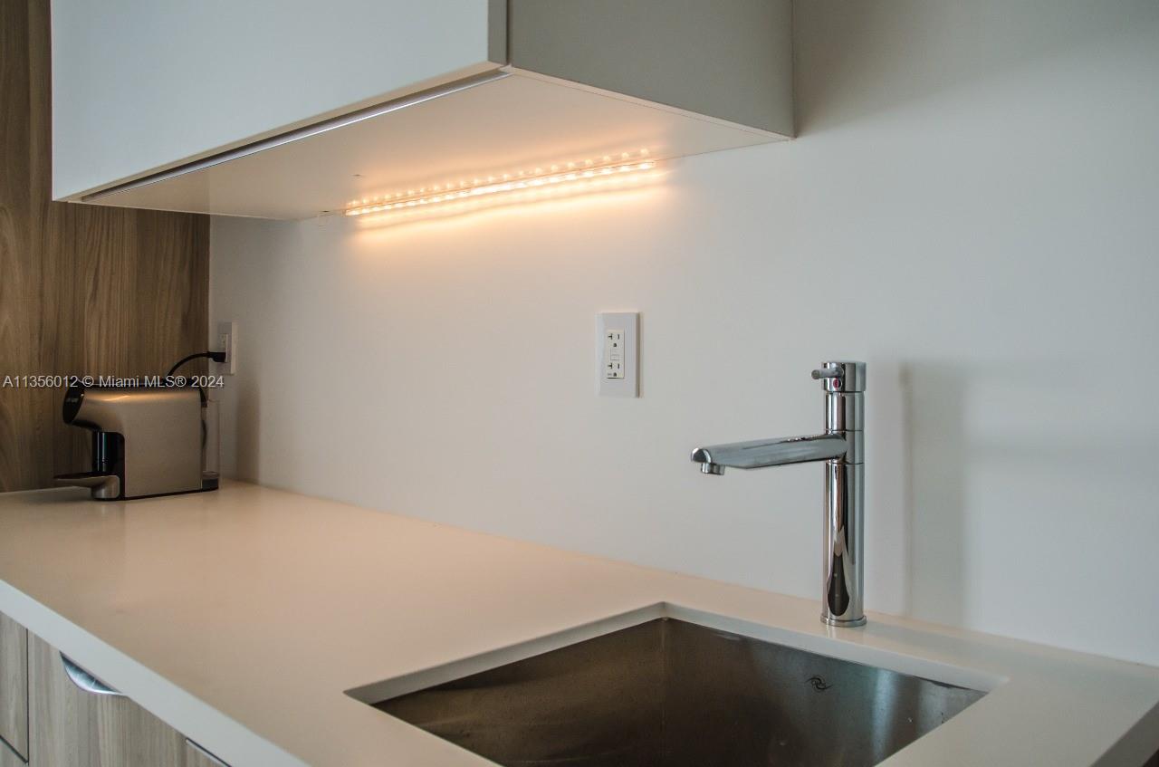 1215 West Avenue, Unit 306 Miami Beach, FL 33139 - Photo 9 of 18 a view of storage and utility room with closet