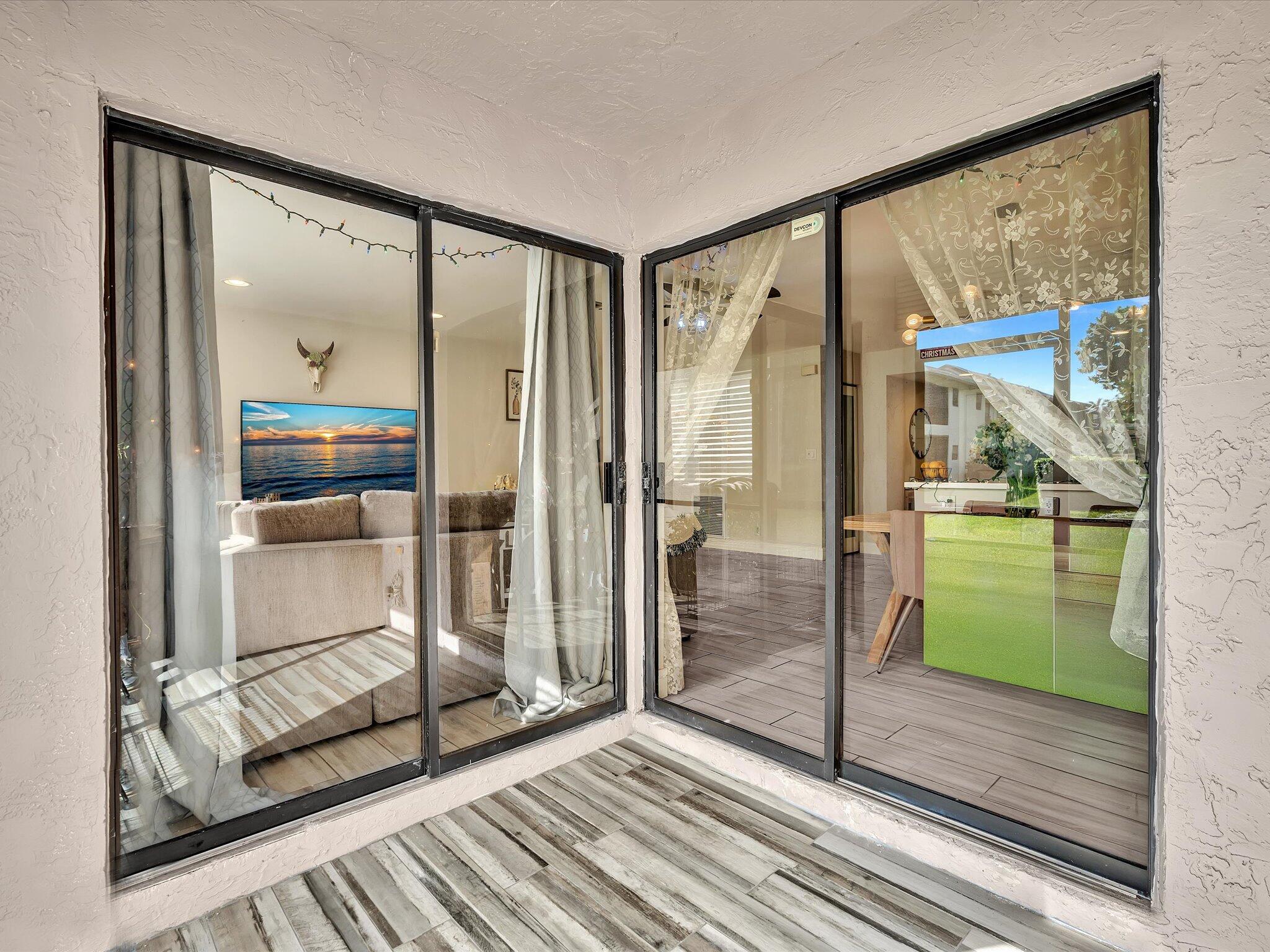 4441 Northwest 22nd Road, Unit 414 Coconut Creek, FL 33066 - Photo 20 of 60 Patio off Living Area